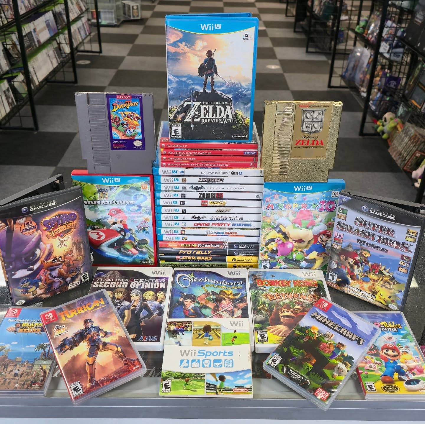 Display of Wii, Wii U, GameCube, and Switch games in original cases at Retro City Games